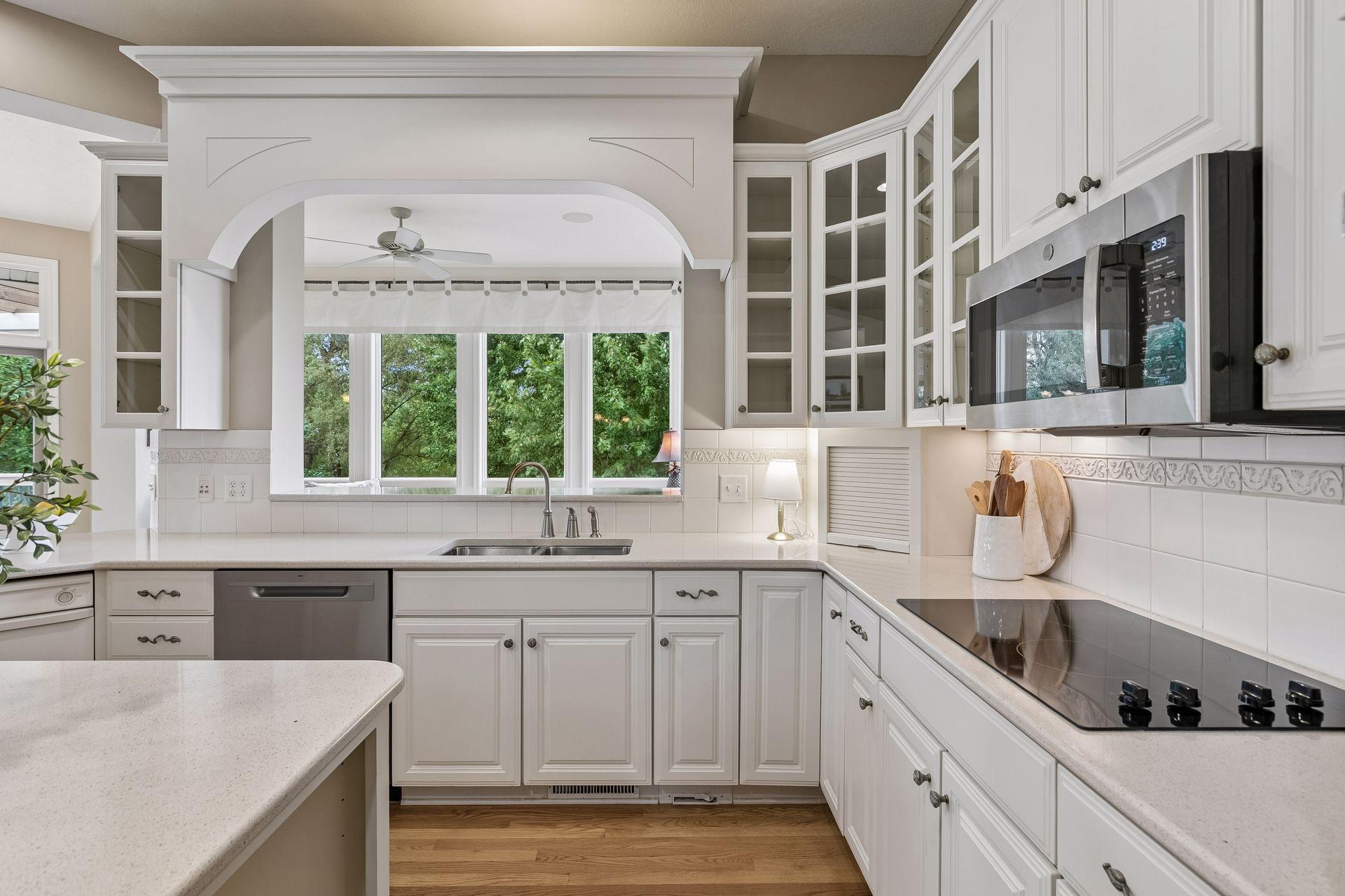 Kitchen opens for informal dining room and sunroom