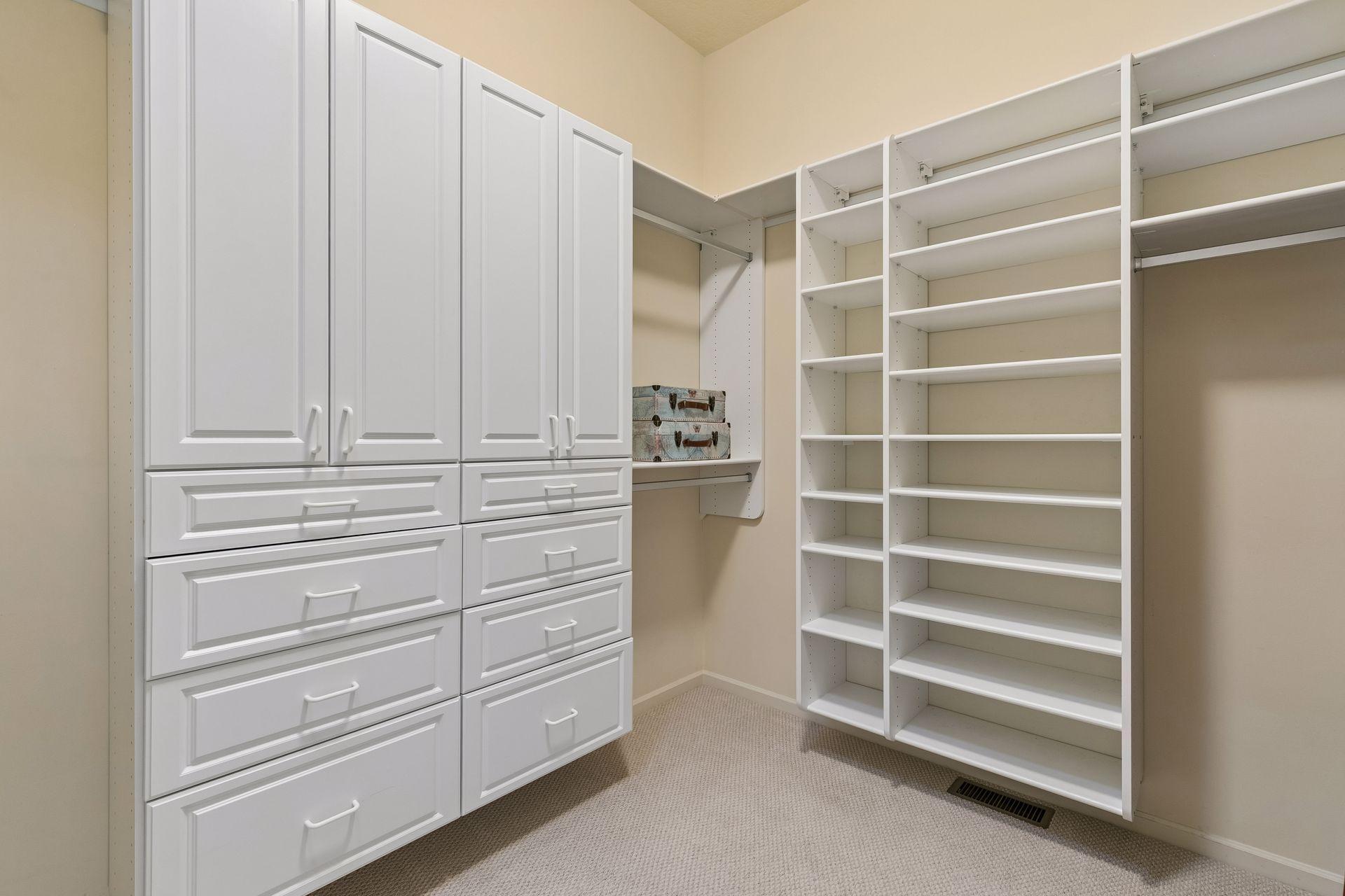 Large primary walk-in closet with custom shelving