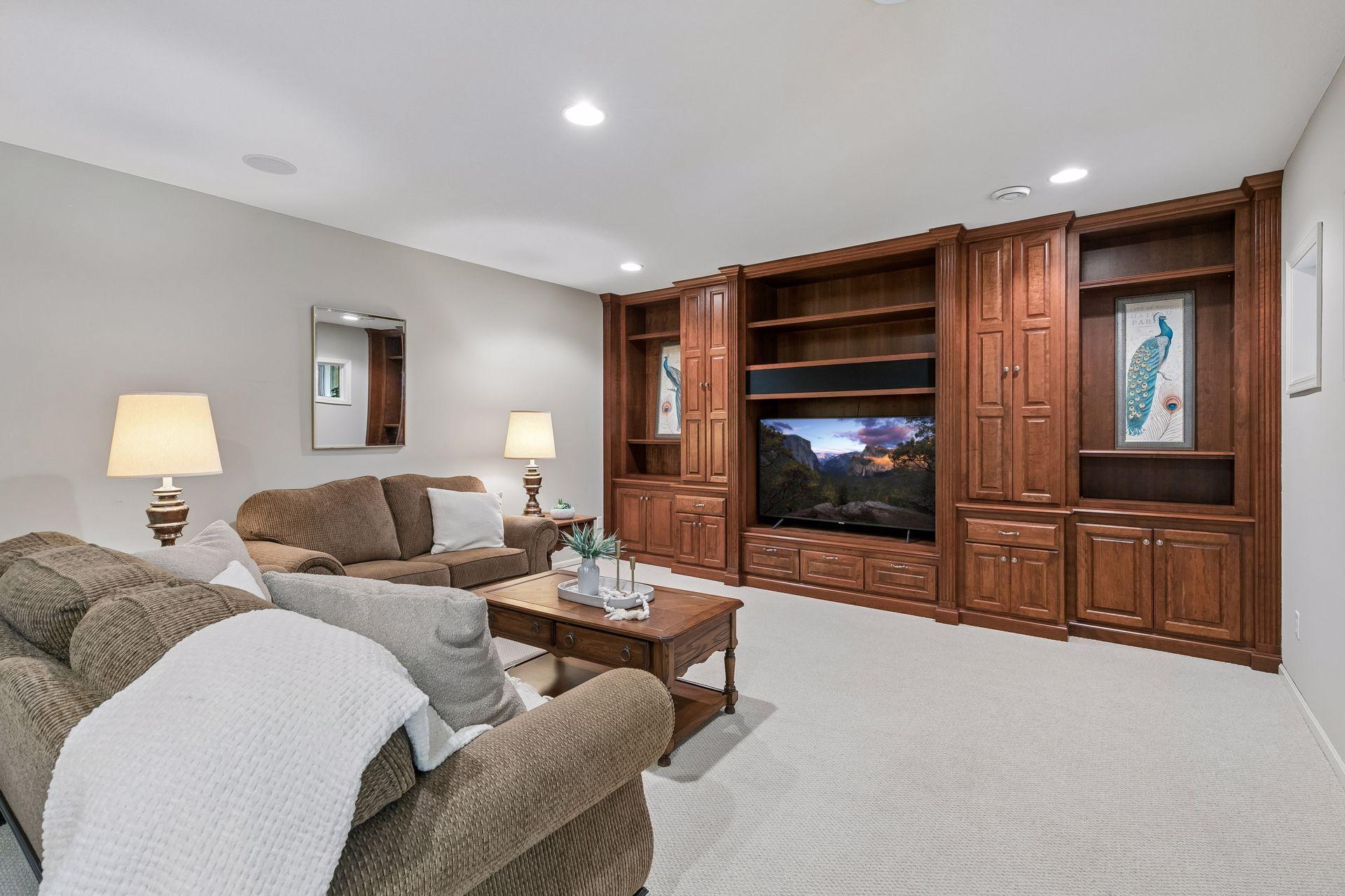 Lower level family room with cherry built-in cabinets