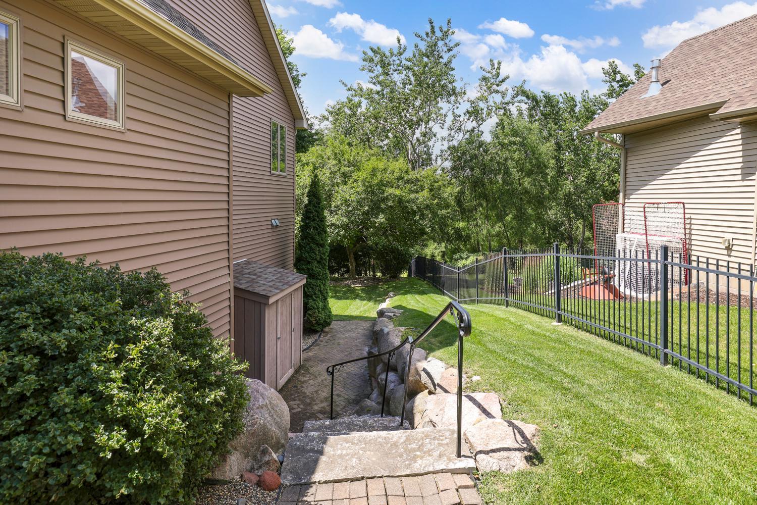 Storage shed on side of home