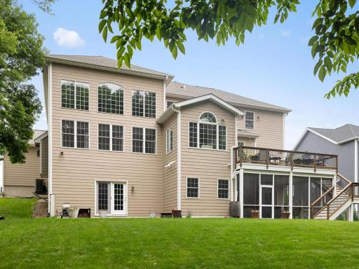 Back side of the home and all the windows, screened in porch & large deck.