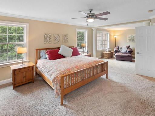 The primary bedroom includes a sitting area off to the right.