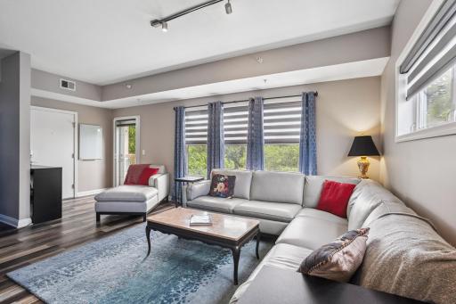 Spacious living room. Electronic blinds throughout the home.