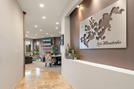 Radiant heated travertine tile underfoot and architectural thoroughfare beckon you lakeside.