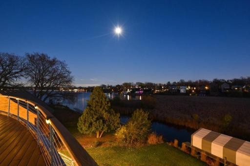 2022 - Landscape design and lighting throughout the property. Level lot to 70 ft of private shoreline.