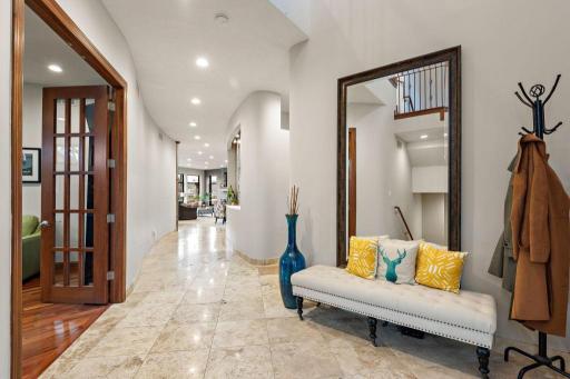 Grand 2-story entry adjourns to the private third-floor primary suite.