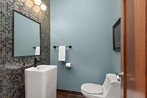 Main floor guest bath is located away from all communal spaces.