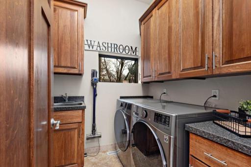 2021 - New Washer & Dryer w/ custom cabinetry and integrated wash basin adorn your main-floor laundry room.