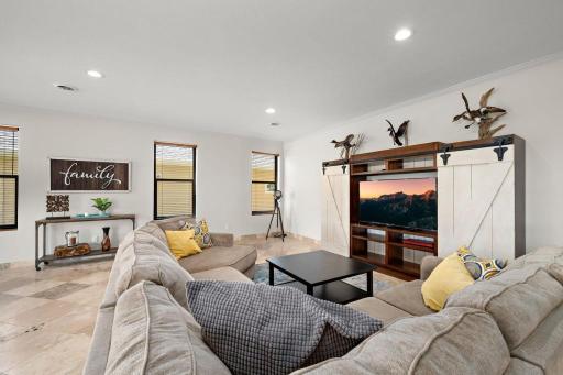Your lower level features 9 ft ceilings, bedrooms 4 and 5, guest bath, entry lounge with custom built-ins, and direct access to your 756 SQFT heated garage w/ hardwired EV Charging station.