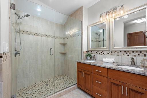 Lower Level Bath. Also includes a modest size walk-in storage closet to compliment the hallway storage closet on this level.