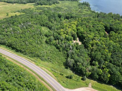 Aerial view of the property with the driveway to the bottom right.