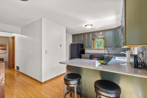 Additional seating at the kitchen counter.