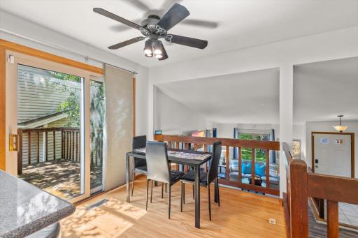 Dining space overlooks the living room and deck.