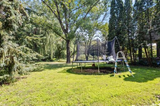 Spacious lot with mature trees for added privacy.