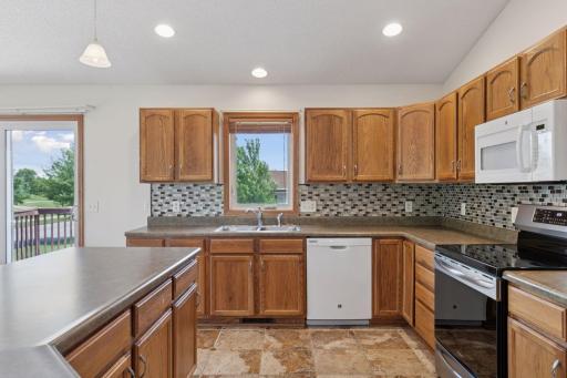 Tons of cabinets and storage in this wonderful kitchen.