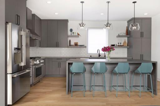 Custom Cabinetry and commercial appliances with floating accent shelving