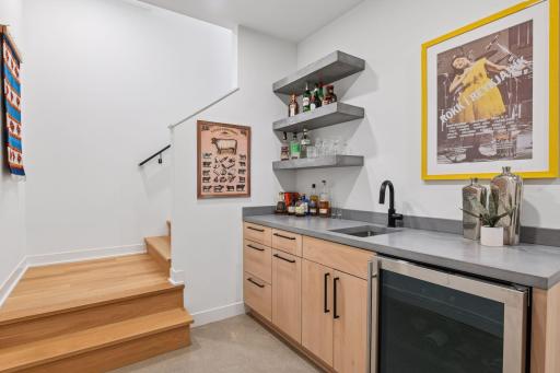 Lower level lounge with wet bar & wine fridge.