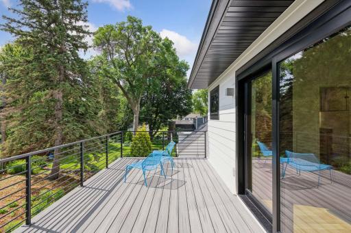 A maintenance free deck and railing are perfect for relaxing off of the primary bedroom