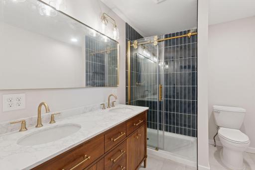 Beautifully finished 3/4 Primary Bathroom with Tiled Shower and Double Sinks