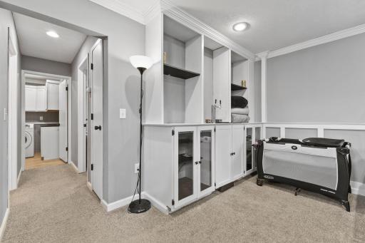 There is a Kegerator in the middle of this cabinet