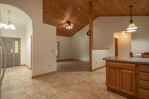 Beautiful entry to Vaulted Living, Kitchen and Dining