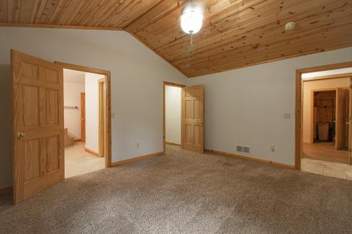 Primary Bath on left and Walk-In Closet on right