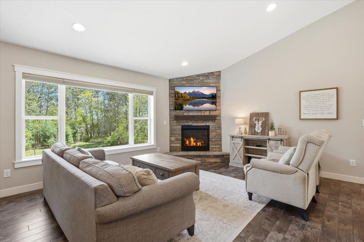 Warm and Cozy with endless natural lighting, the main living room is open to kitchen, dining, entry and more