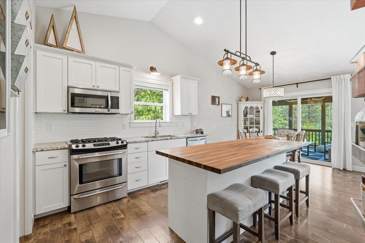 This kitchen has a gas range, ample counter space, a large corner pantry closet and plenty of room for entertaining