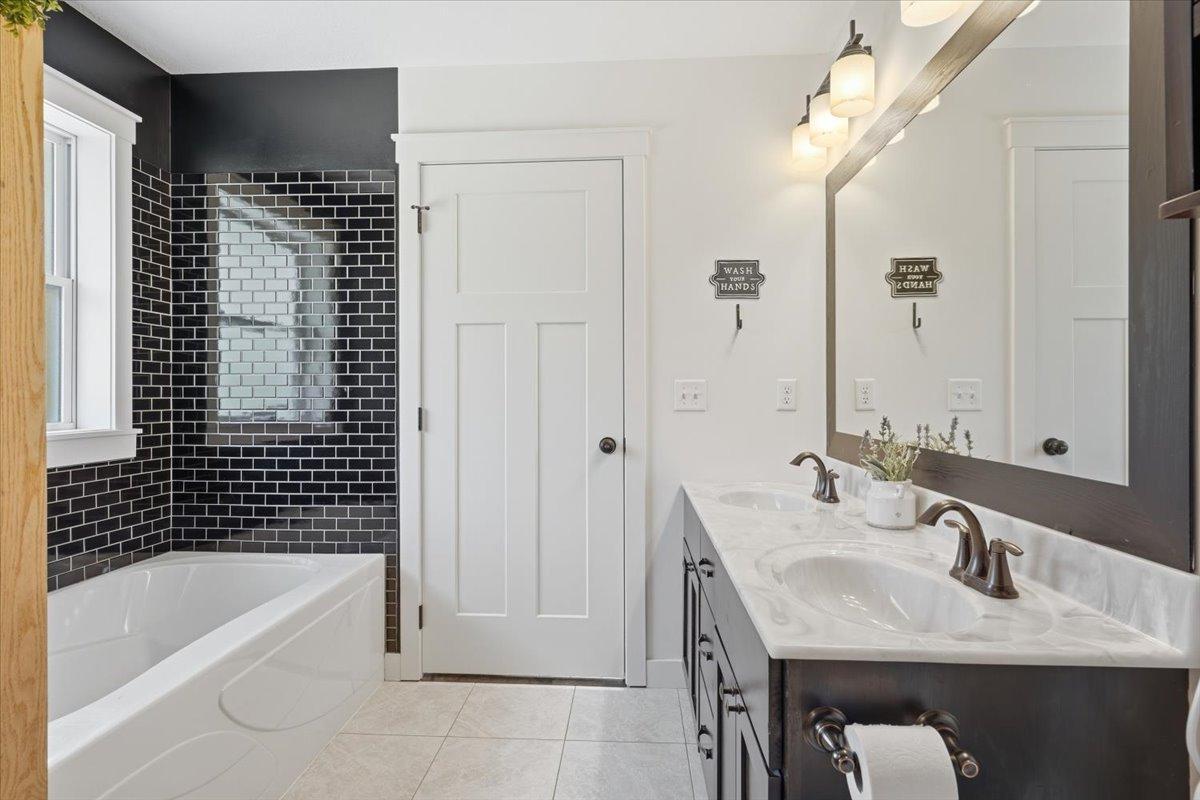 Soaker tub in primary ensuite for those much needed relaxing moments