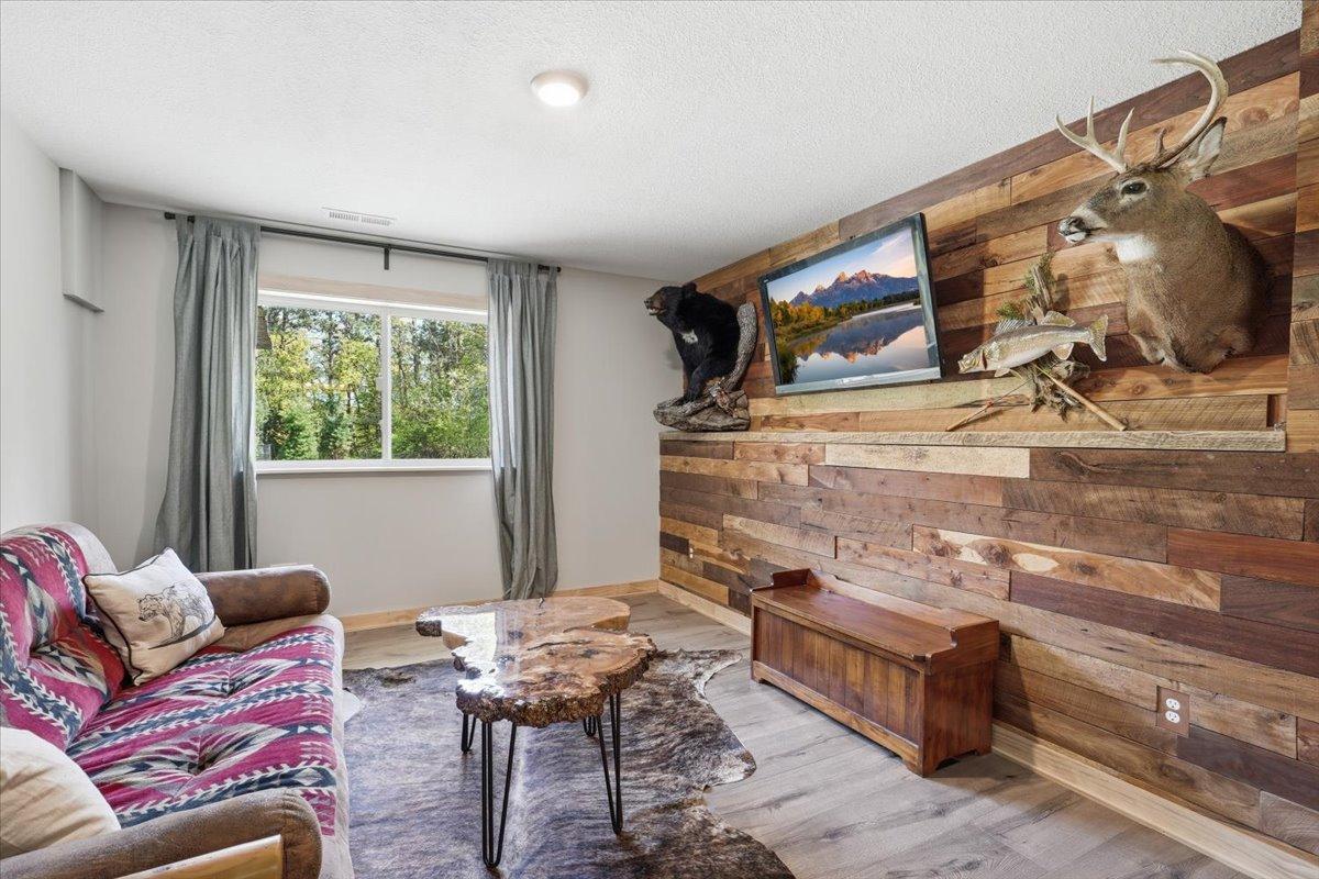 Currently used as an additional relaxation space, this beautiful room is bedroom 5, located in the lower level