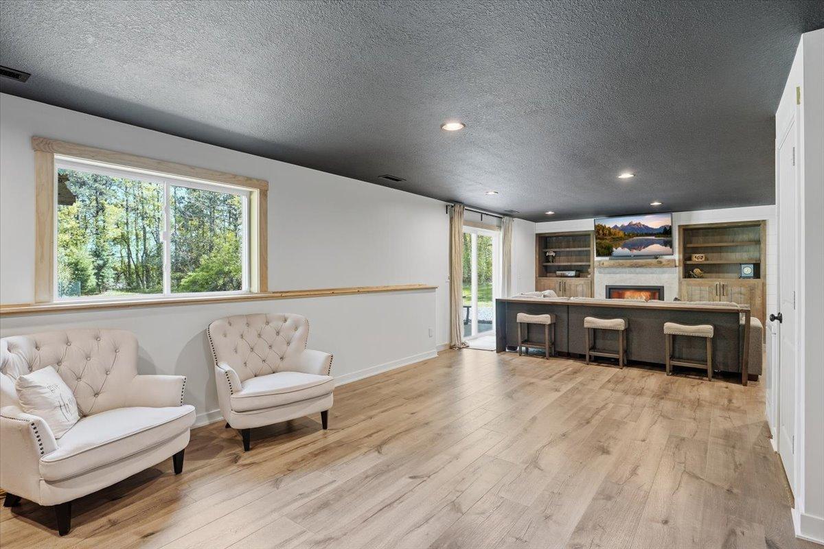 Although not built, the homeowners ensured there was plumbing and electrical run to the large feature wall of this basement for a future bar, mother-in-law kitchen or whatever desired.