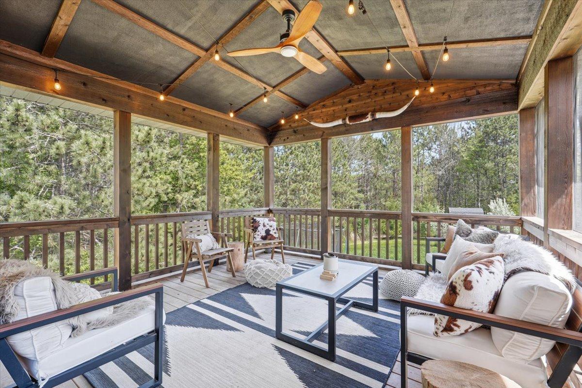 One of the favorite rooms of the house, connecting the interior to the sounds and smell of nature. This screened in porch is pure perfection, located right off the dining room