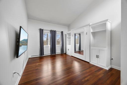 The second bedroom can be used for a variety of things due to the built-in Murphy bed wall system and walk in closet.