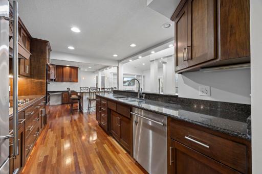 The kitchen is open to the entire living space of the condo, enjoy cherry cabinets, Stainless steel appliances including a new double oven/microwave!