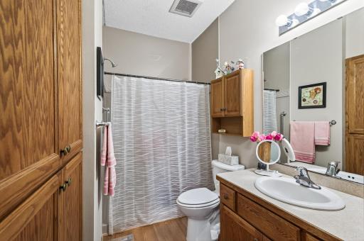 Lots of storage and an oversized step in shower are a great addition to this private retreat.