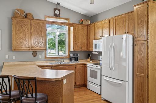 The kitchen is efficient with plenty of storage and prep space.