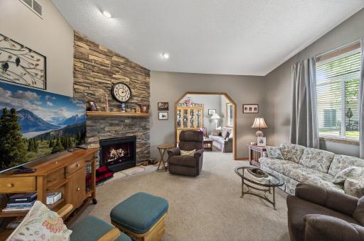 The living room offers abundant natural light and a cozy gas fireplace is the perfect addition in this inviting space.