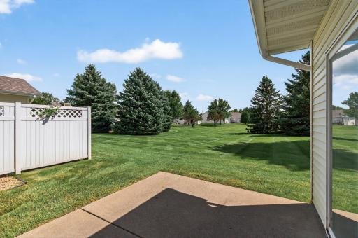Step outside and youâre greeted by a serene view of lush open space dotted with mature pine treesâan ideal peaceful retreat to enjoy your morning coffee or unwind in the evening.