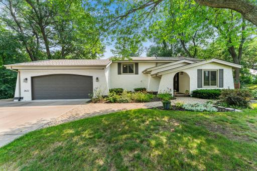 This charming 3-bedroom, 2-bathroom home boasts numerous updates and is nestled in a peaceful, tree-lined neighborhood.