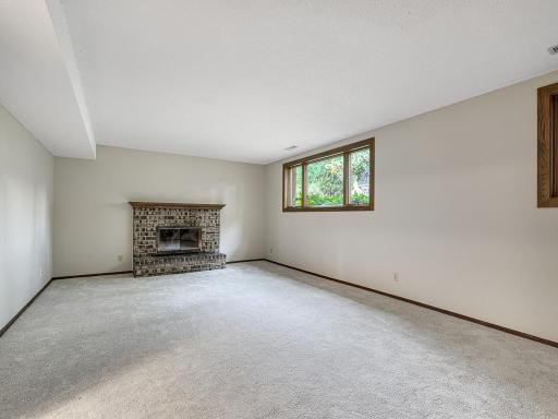 The lower level family room has great light and a wood burning fireplace!