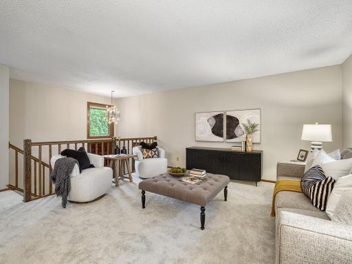 The inviting front entryway carries you into the generous living room.
