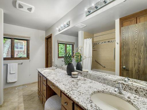 The main level bath is beautifully renovated with a double vanity!