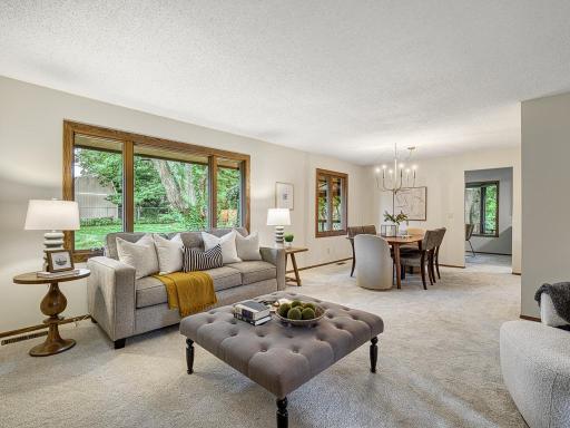 Spacious living and dining area with oversized windows for ample natural light!