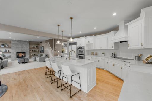 A stylish tile backsplash and a spacious 6x6 walk-in pantry enhance both function and design.