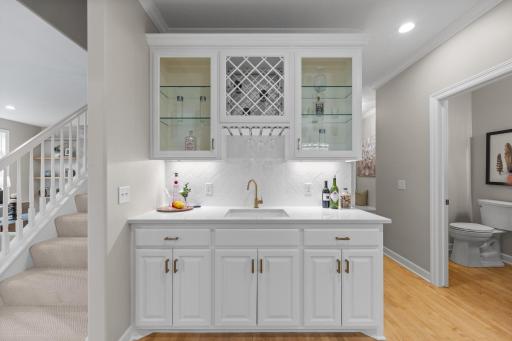 A view of the stylish wet bar adjacent to the formal dining room.
