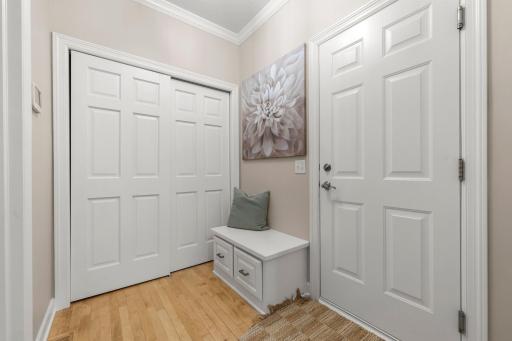 Just off the garage entry, a spacious mudroom leads to a well-equipped laundry room.