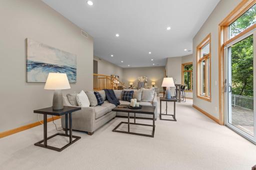 A different angle showcasing the open layout of the lower-level family and recreation area.