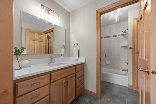 The well-appointed Jack-and-Jill bathroom, which provides each bedroom with its own private vanity area and shared access to a full bathroom complete with a tub and shower combo.
