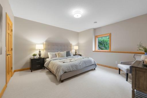 Located on the lower level, bedroom five features a spacious walk-in closet and brand-new carpeting.