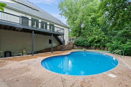 Another view of the heated in-ground pool, perfect for enjoying warm summer days.